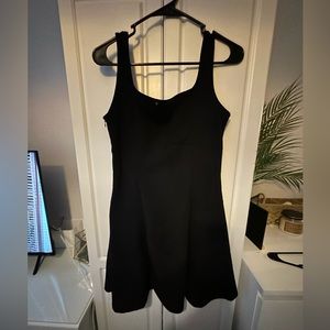 Woman’s black cocktail dress